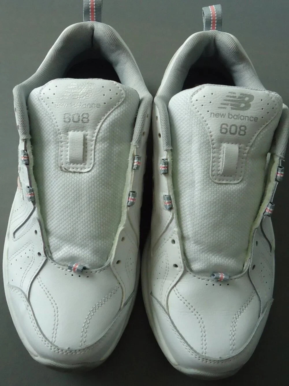 SIZE 9.5. D. New Balance women's white leather sneakers shoes.